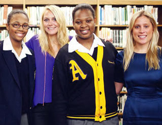 Photo of Jody and Chelsea Morrison with students