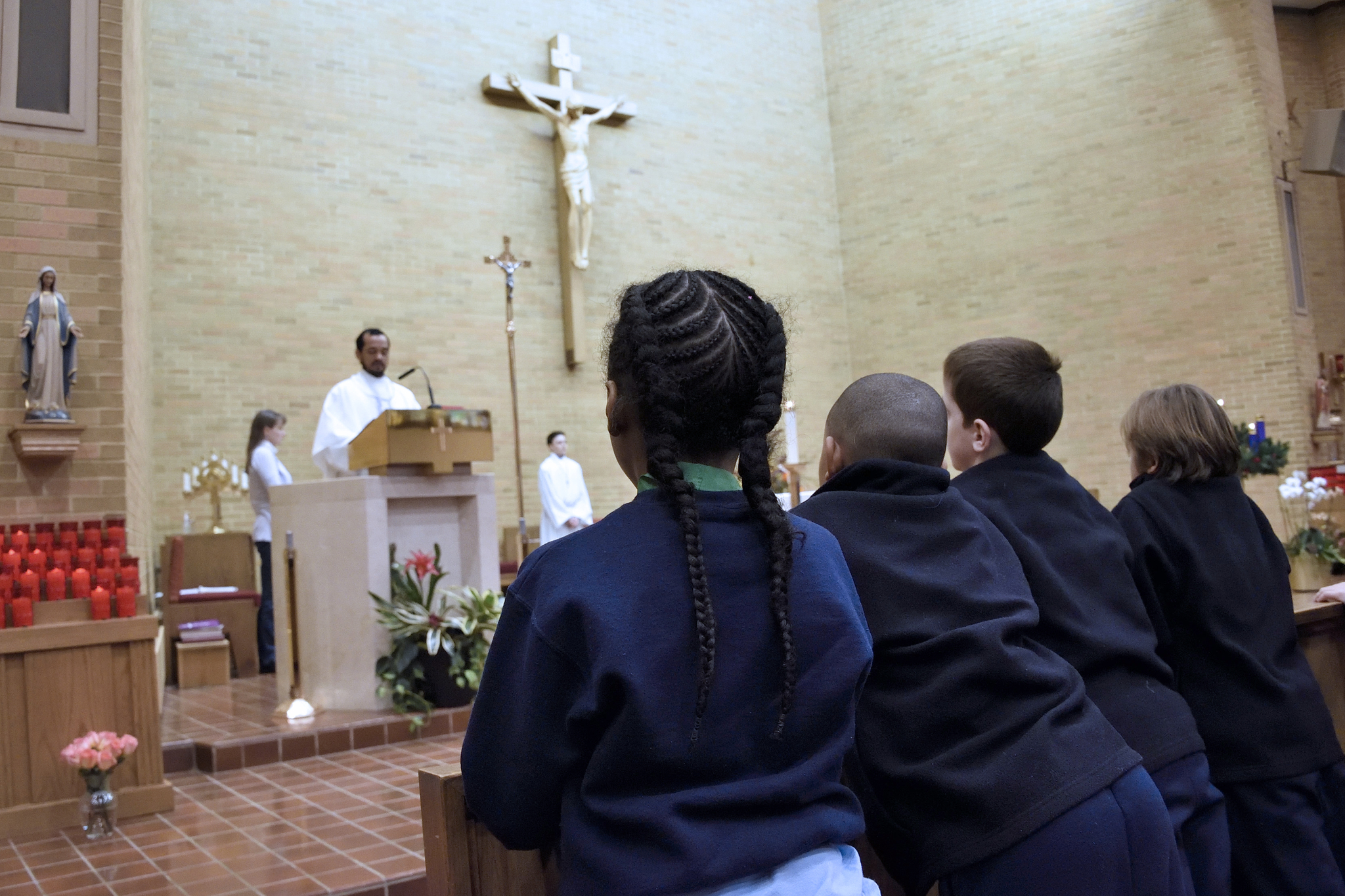 Catholic school students in prayer
