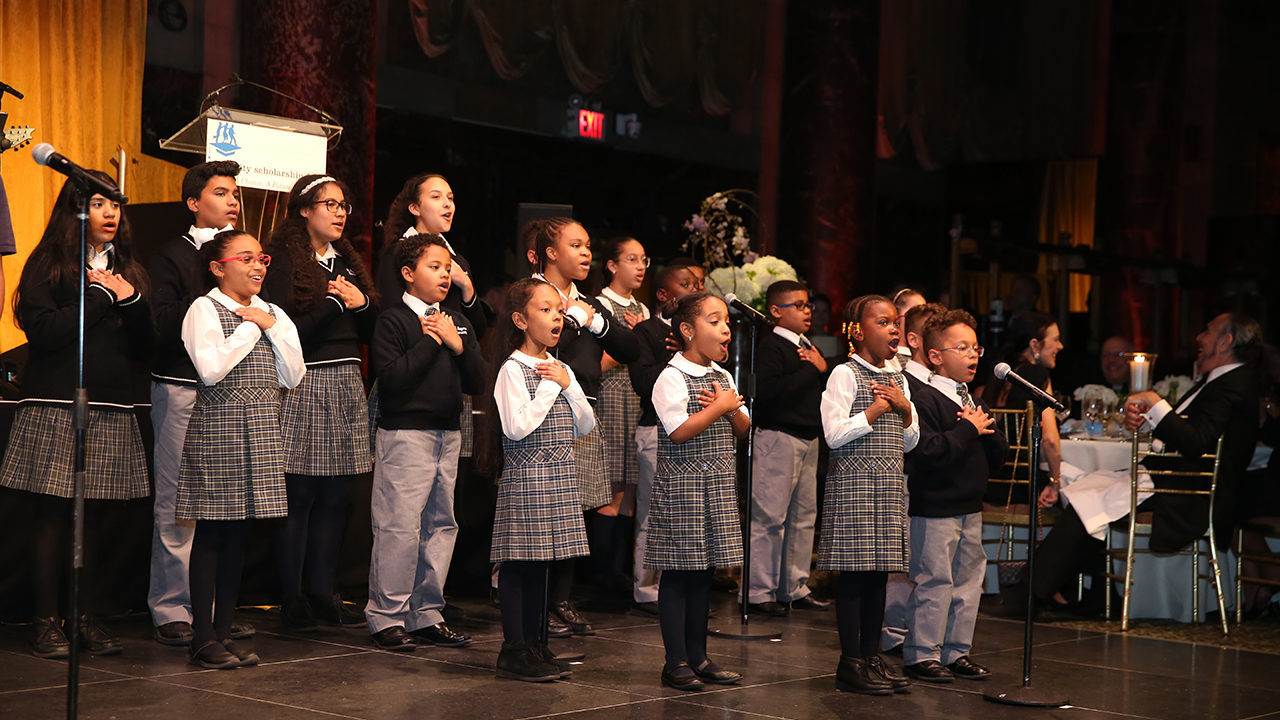 Students singing at the Inner-City FRIENDS Gala